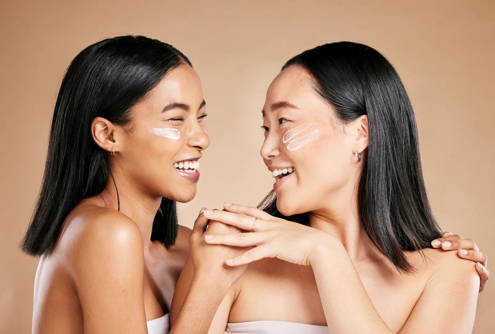 Two women with radiant, healthy skin